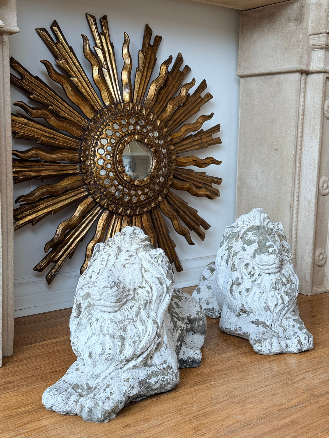 Pair of 20th-century French cast stone recumbent garden lion sculptures by Housebound Interiors, detailed stone lion figures for outdoor decor