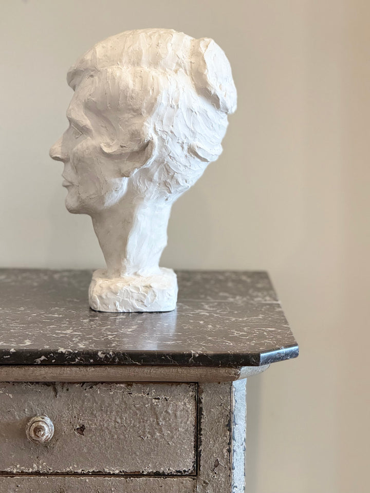Studio study of a Mid-Century Modern plaster female bust sculpture by Housebound Interiors, showcasing detailed facial features.