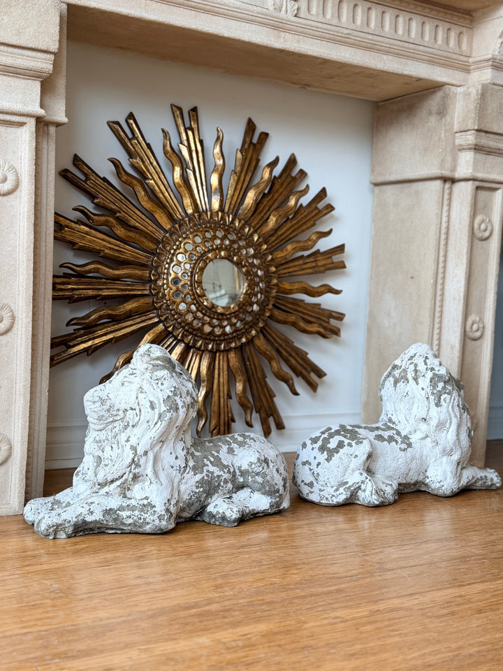 Pair of 20th-century cast stone recumbent garden lion statues by Housebound Interiors, detailed stone lion figures for outdoor decor.