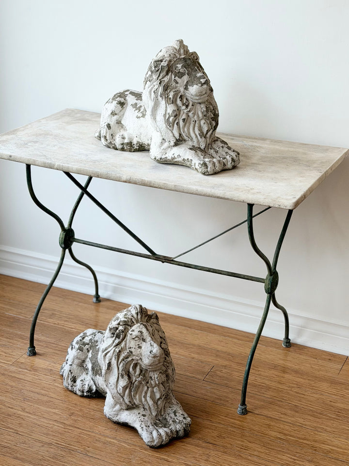 19th-century French iron and marble garden table with intricate ironwork and polished marble top, vintage outdoor furniture piece.