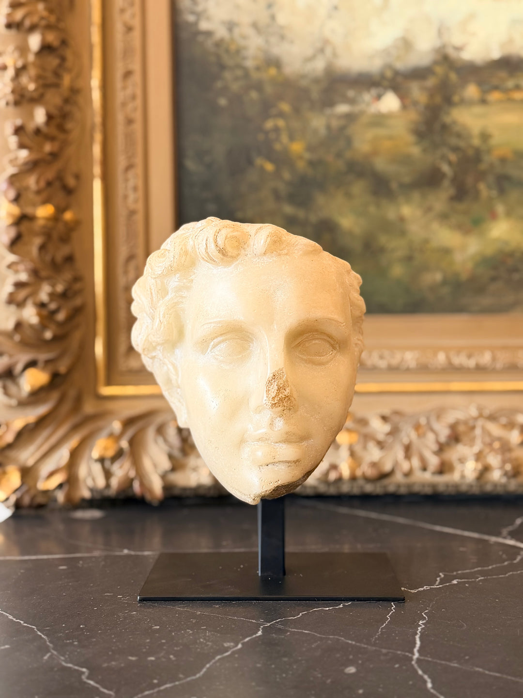 Classical bust of a youth sculpture mounted on iron plinth, detailed marble-style fragment for interior decor by Housebound Interiors