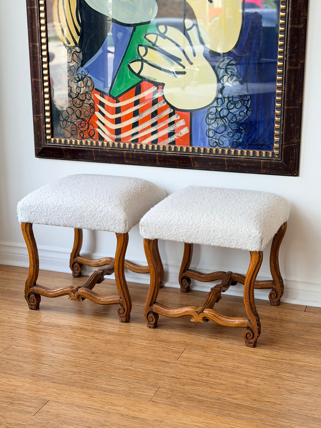Pair of antique scroll leg stools from Italy by Housebound Interiors, showcasing carved wood legs and vintage craftsmanship.