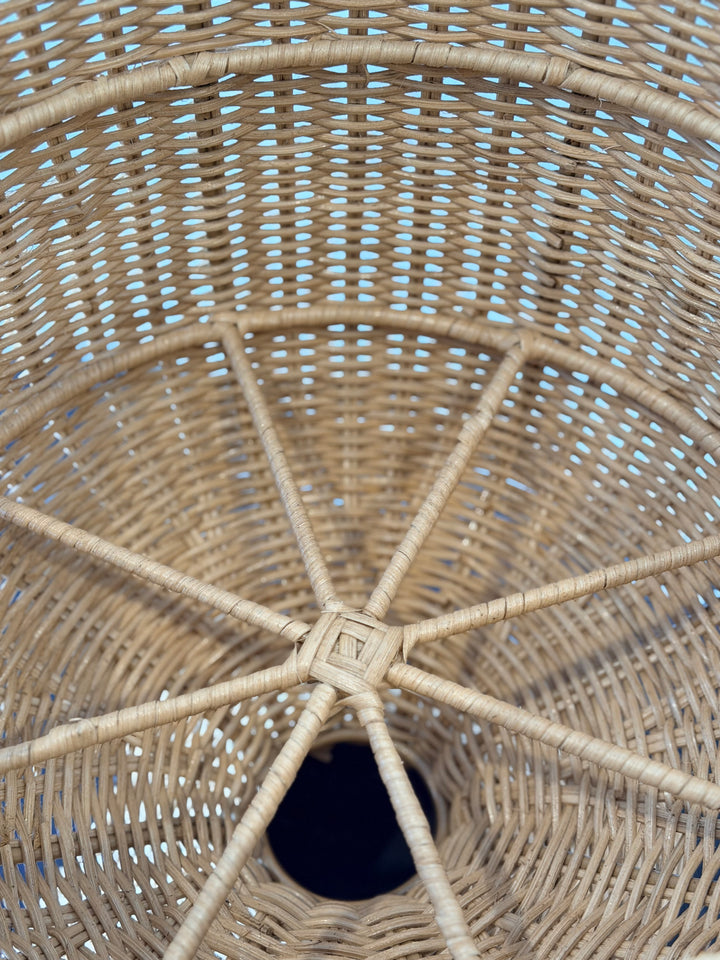 Woven rattan urn-form planter from Housebound Interiors with a rounded shape and natural textured finish, perfect for indoor or outdoor decor.