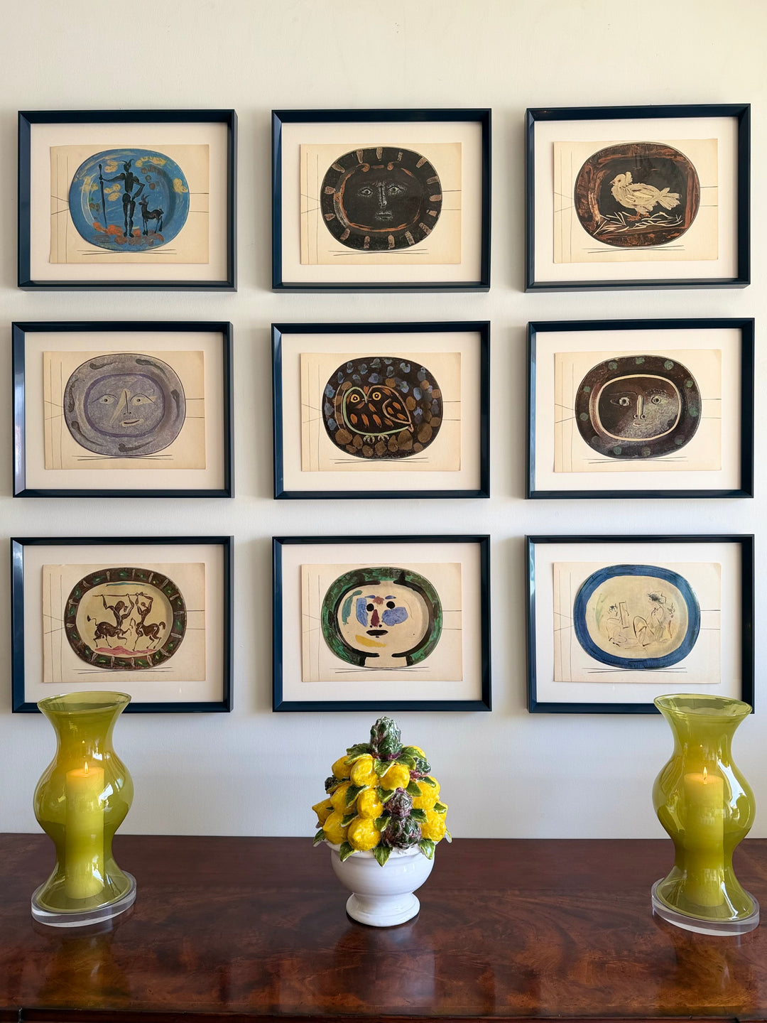 Nine tipped-in color lithographs from Céramiques de Picasso, 1948, featuring vibrant ceramic-inspired artwork by Pablo Picasso.