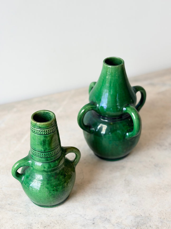 Pair of Belgian green glazed ceramic vessels from the mid-20th century, showcasing classic design and rich glaze details.