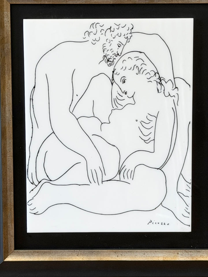 Couple Enlacé sculpture by Pablo Picasso from the 1970s, displayed on a wooden stand, with a textured background.