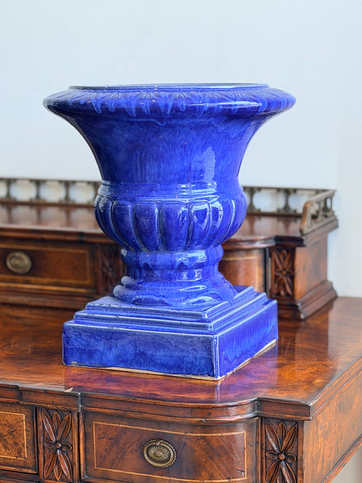 Italian cobalt glazed ceramic urn with intricate design, crafted by Housebound Interiors, displayed on a neutral background.