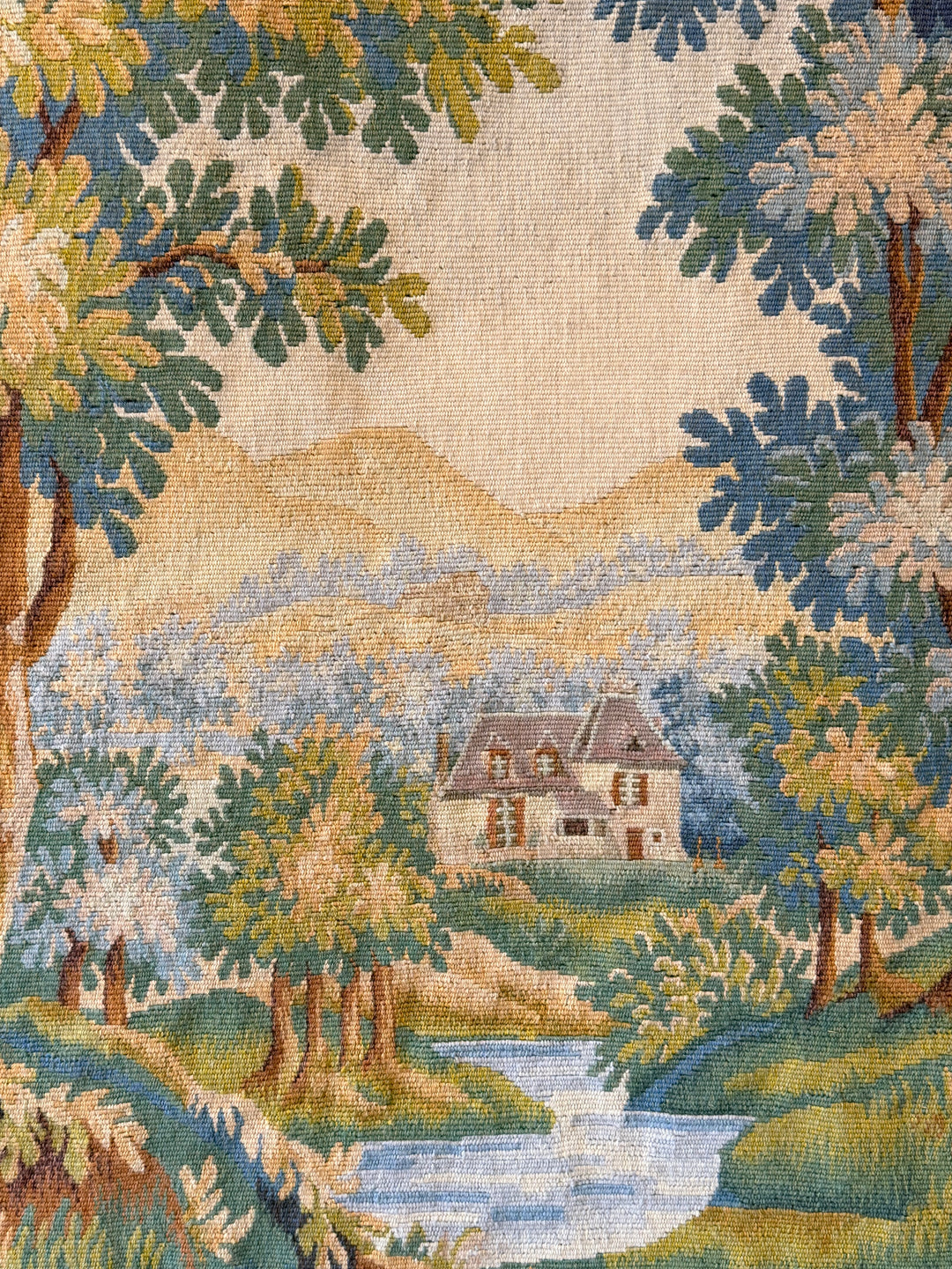 Early 20th century French verdure tapestry featuring birds and a serene countryside landscape from Housebound Interiors.