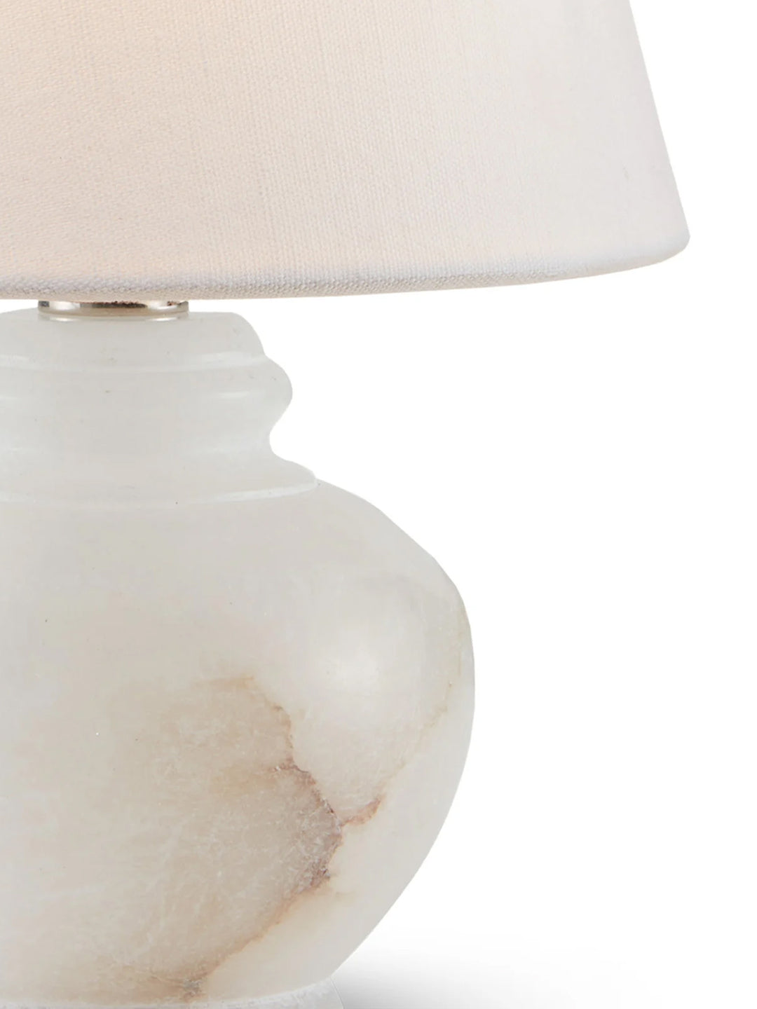 Petite alabaster table lamp by Housebound Interiors with a smooth, rounded base and soft fabric shade, ideal for bedside or desk.