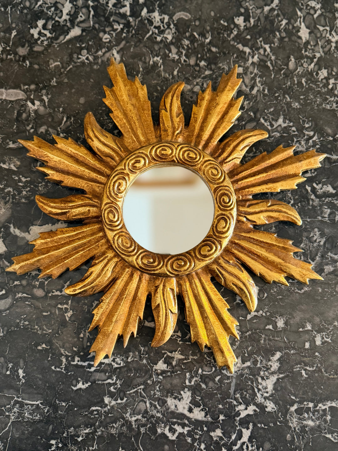 Gilt sunburst Louis XIV style mirror with ornate gold frame and radiating design, decorative wall mirror by Housebound Interiors