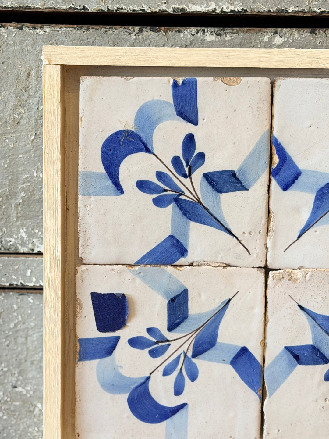 Antique blue and white ceramic tile panel with intricate floral patterns from Housebound Interiors.