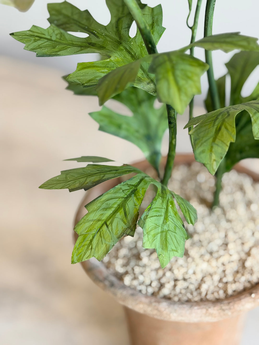 Ranunculus Tole sculpture in aged terracotta pot by Housebound Interiors, featuring a pale green decorative floral arrangement.