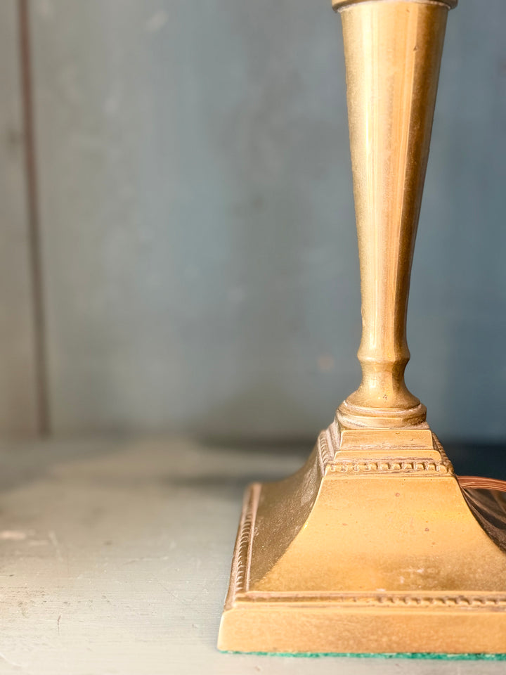 Pair of English brass candlestick table lamps with detailed craftsmanship and antique finish from Housebound Interiors.
