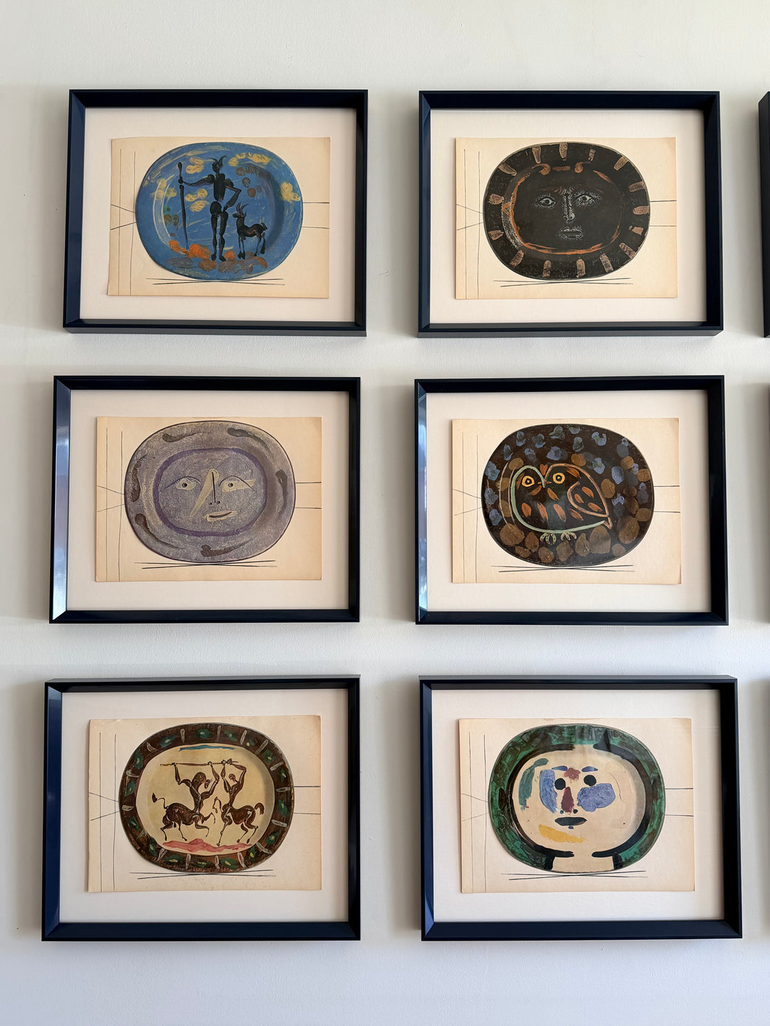 Set of nine tipped-in color lithographs from Picasso's Céramiques de Picasso, 1948, showcasing vibrant ceramic-inspired artwork.