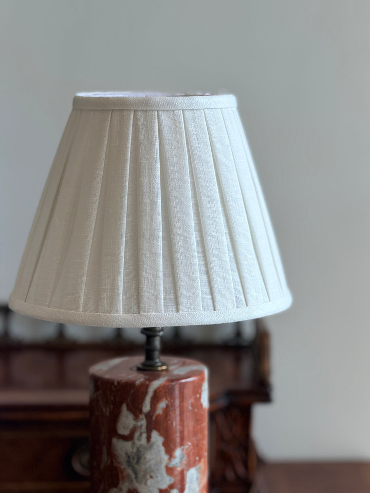 Italian Rouge and Ivory marble column lamps with custom pleated shades, featuring elegant design and intricate detailing.