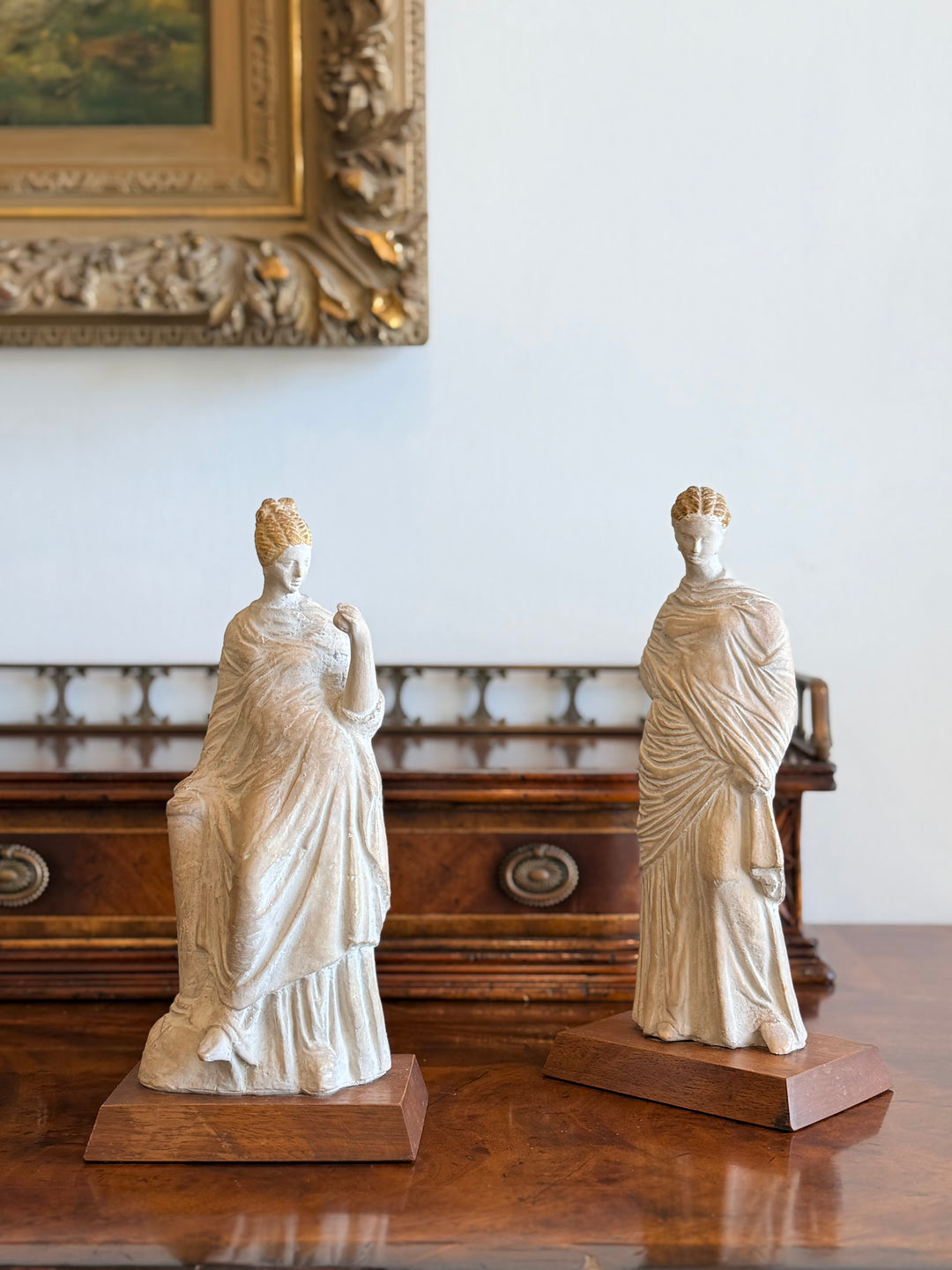 1970s classical female figures plaster casts on wood bases, showcasing draped sculptural art from Housebound Interiors.