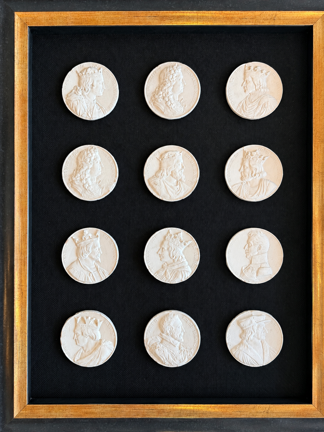 19th-century French royal portrait intaglios featuring intricate carved profiles, displayed on a neutral background.