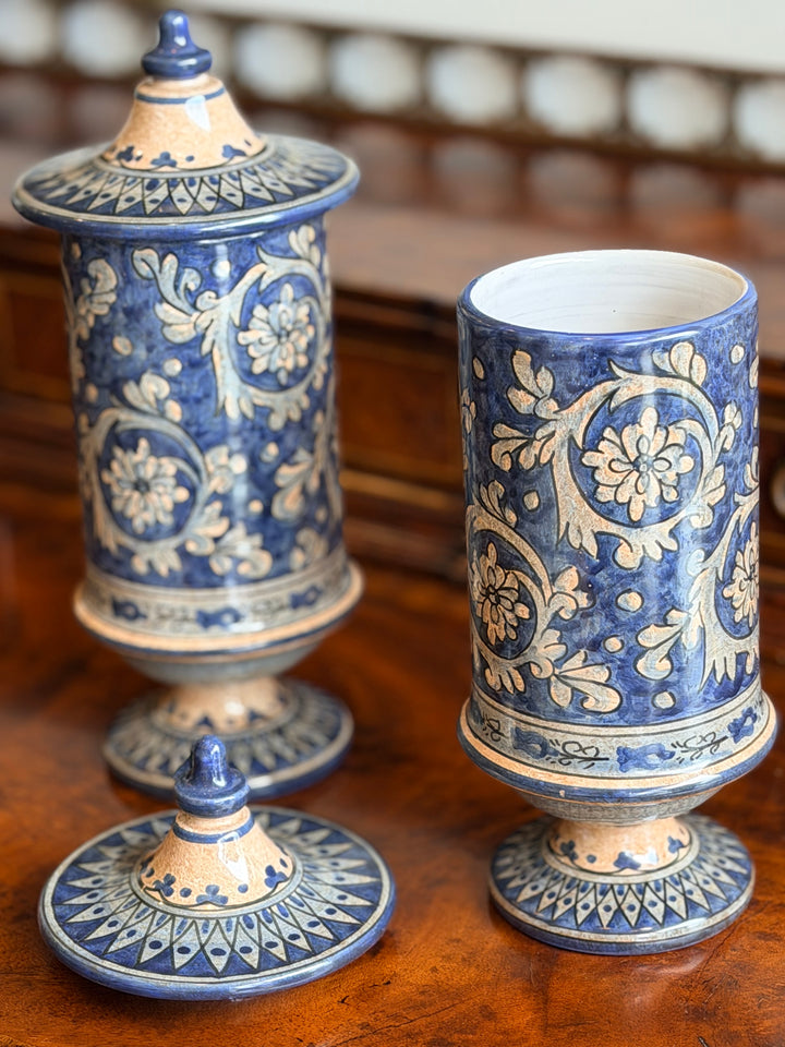 Pair of vintage Italian faience lidded urns with intricate hand-painted designs, perfect for classic home décor.