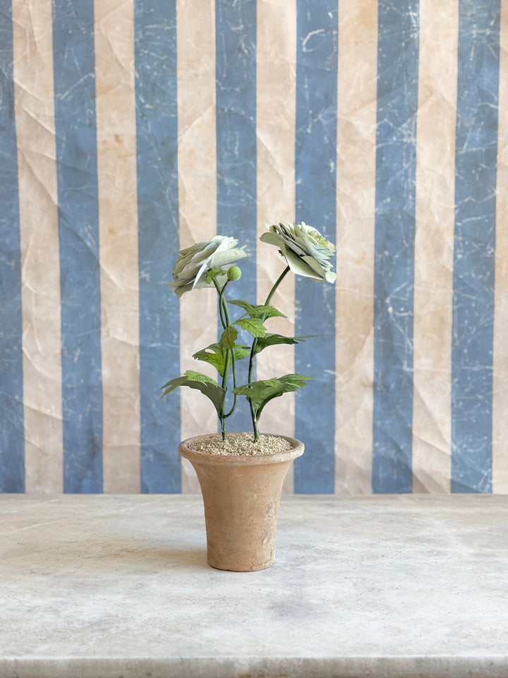 Ranunculus Tole sculpture in aged terracotta pot by Housebound Interiors, featuring a delicate pale green floral design.