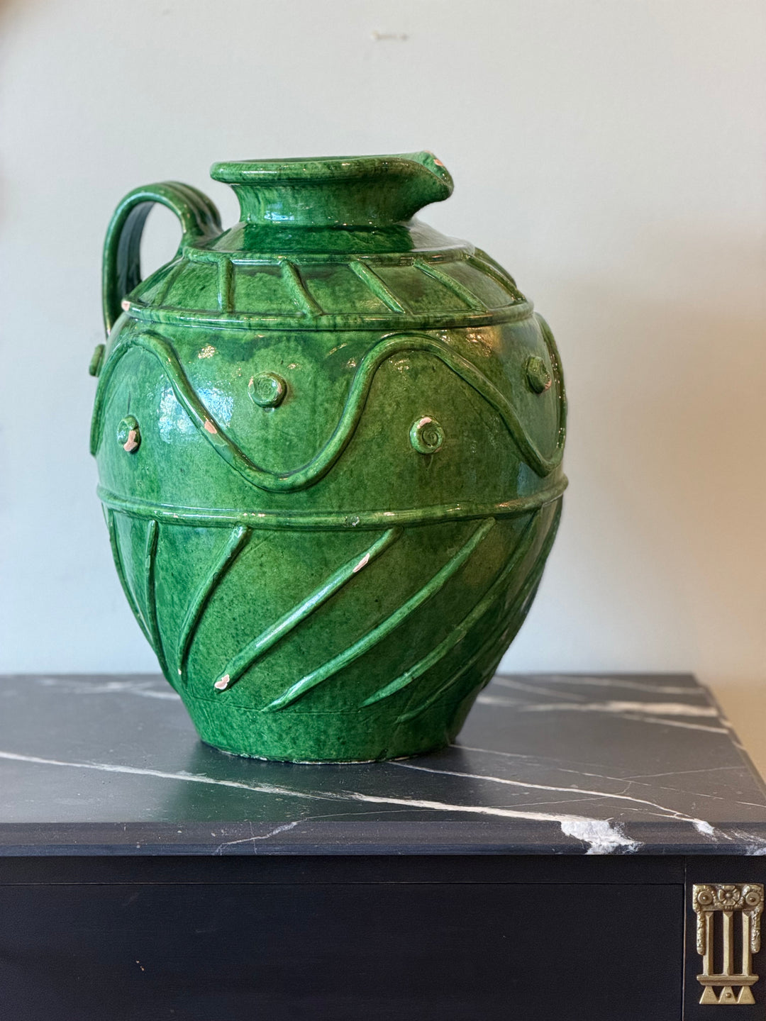 Large Italian emerald glazed pottery vase with sculptural relief decoration, perfect for decorative display or floral arrangements.