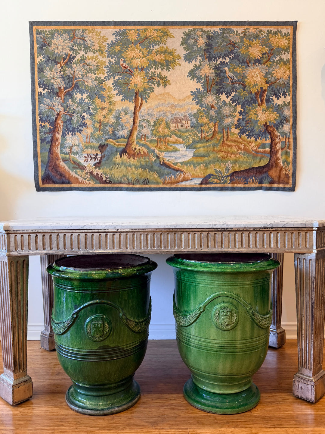 Early 20th Century French Verdure tapestry featuring birds and a picturesque countryside landscape.