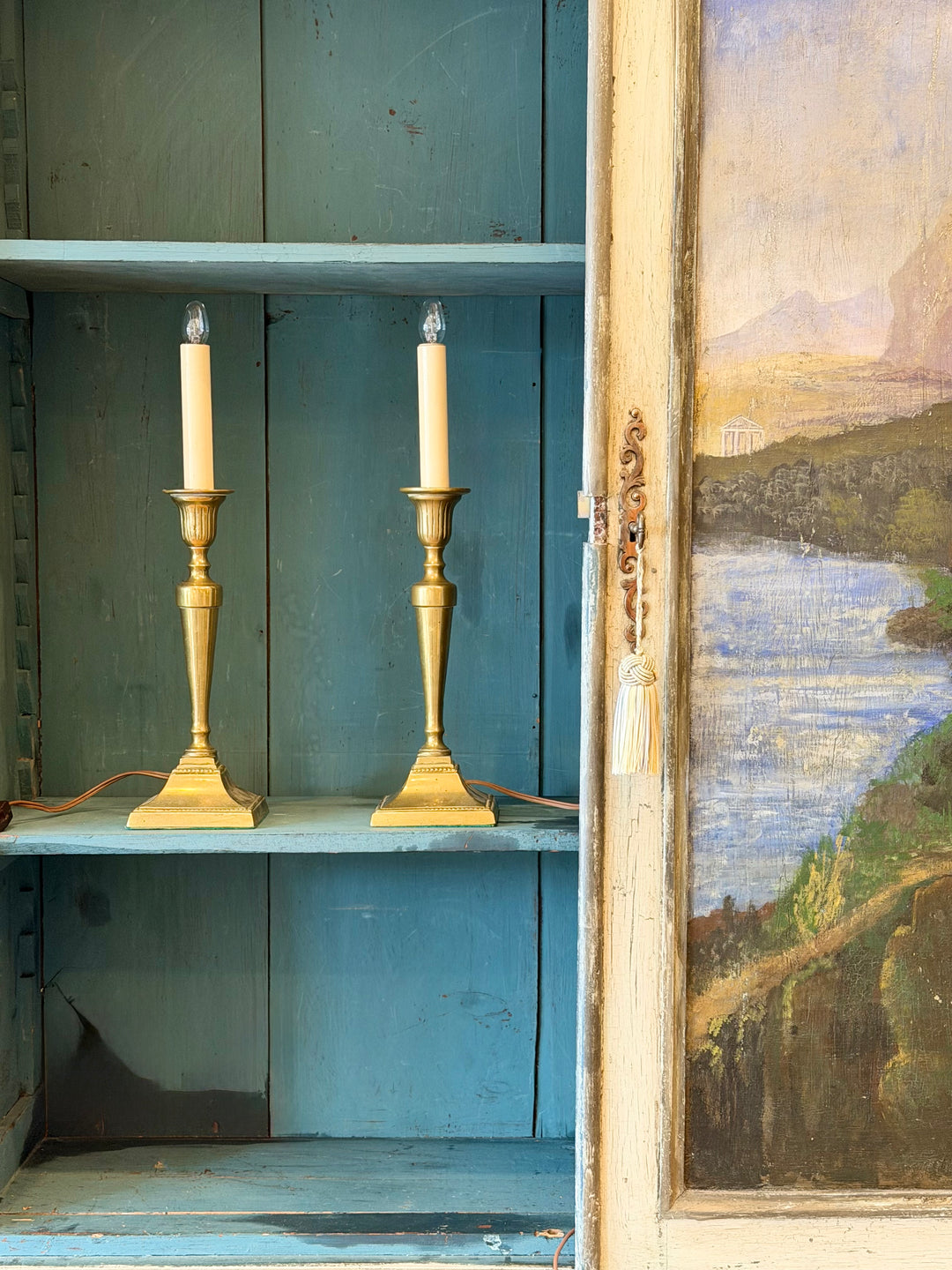 Pair of English brass candlestick table lamps with ornate detailing, perfect for vintage or classic home decor.