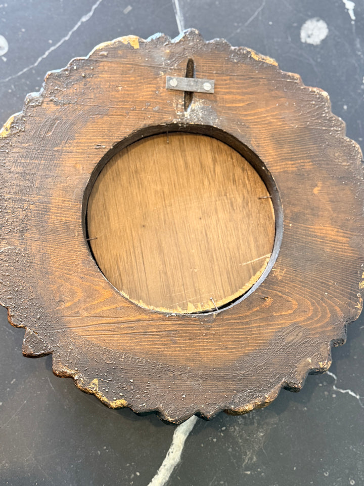 Antique Italian carved giltwood sunburst mirror with octagonal frame, detailed craftsmanship, ornate decorative wall mirror.
