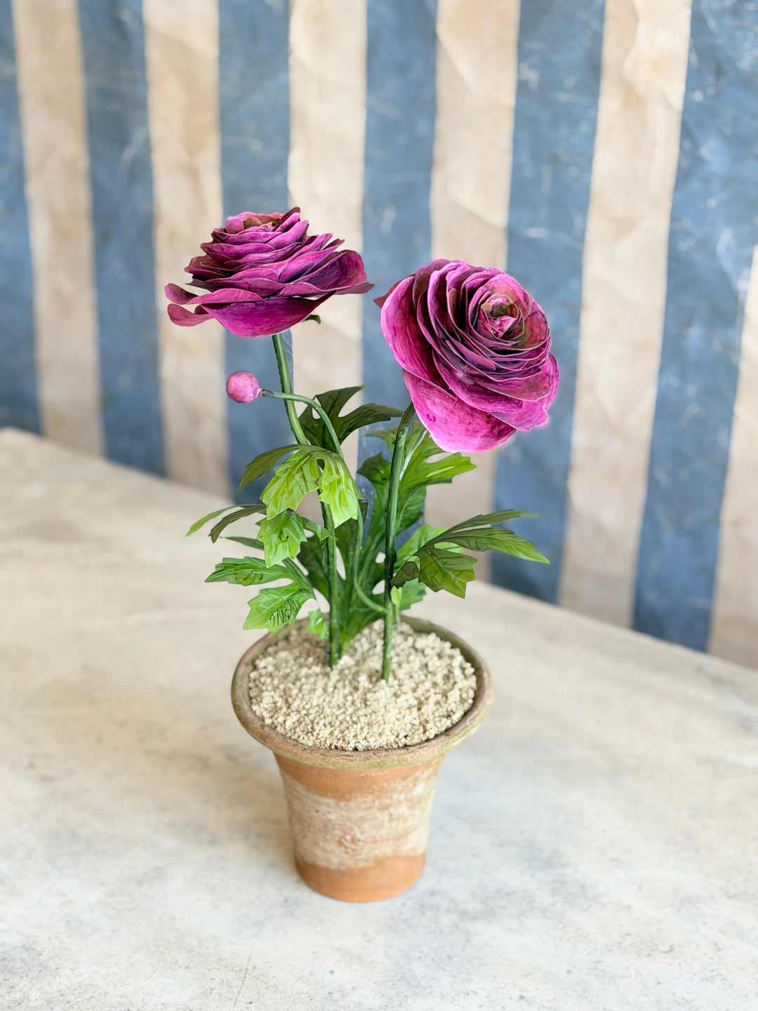 Ranunculus Tole sculpture in aged terracotta pot with magenta flowers, decorative Housebound Interiors floral art piece.
