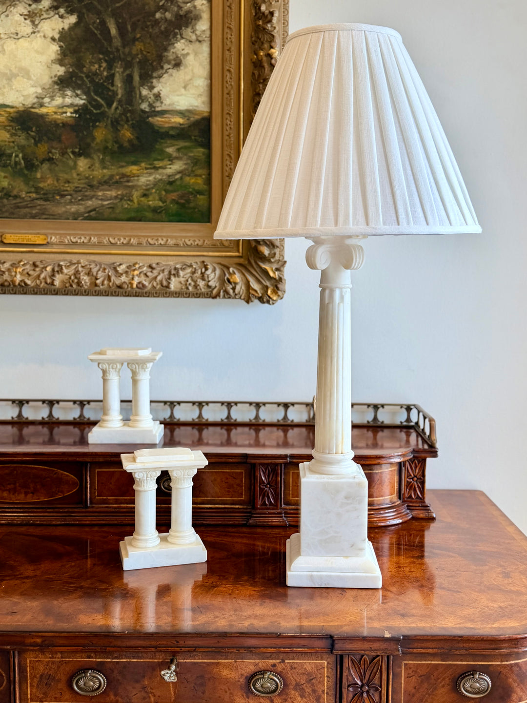 Large Italian marble column table lamp with custom pleated linen shade, featuring elegant craftsmanship and classic design.