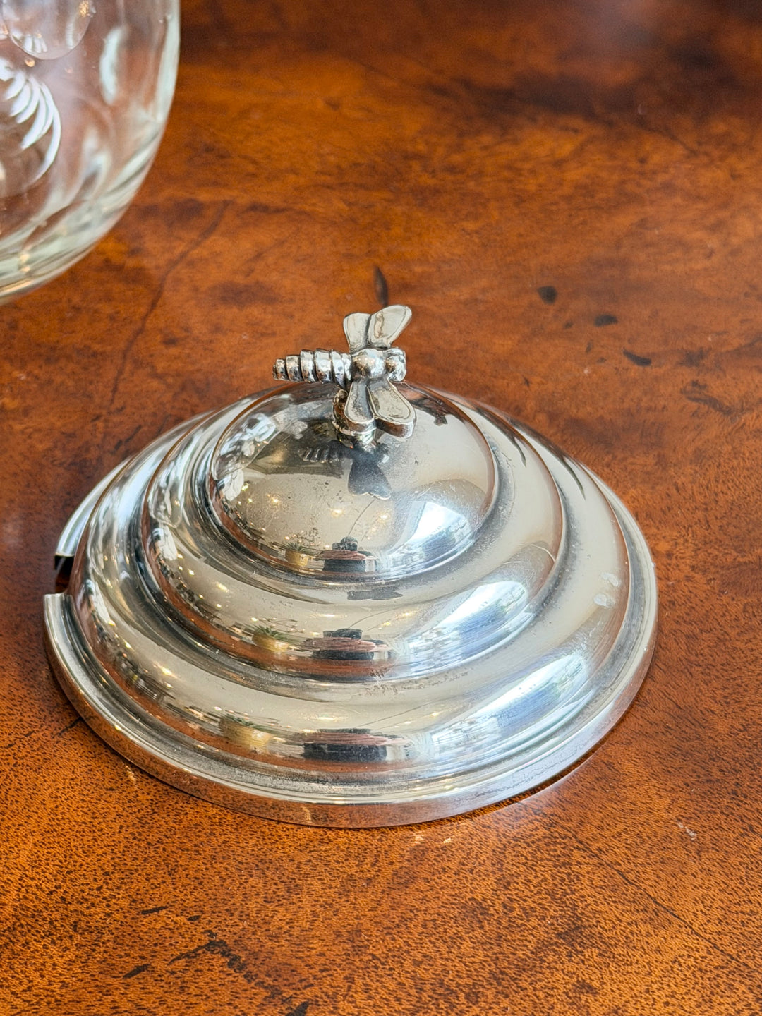 Cartier sterling silver and crystal honey pot with dragonfly finial, decorative glass container with intricate design.