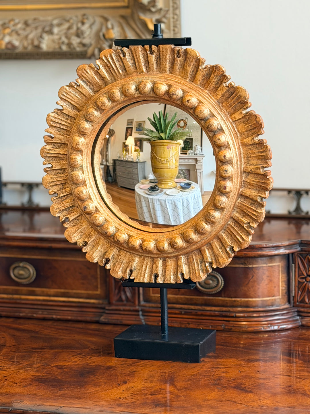 Italian convex mirror by Housebound Interiors with a round frame and reflective glass, designed for stylish wall decor.