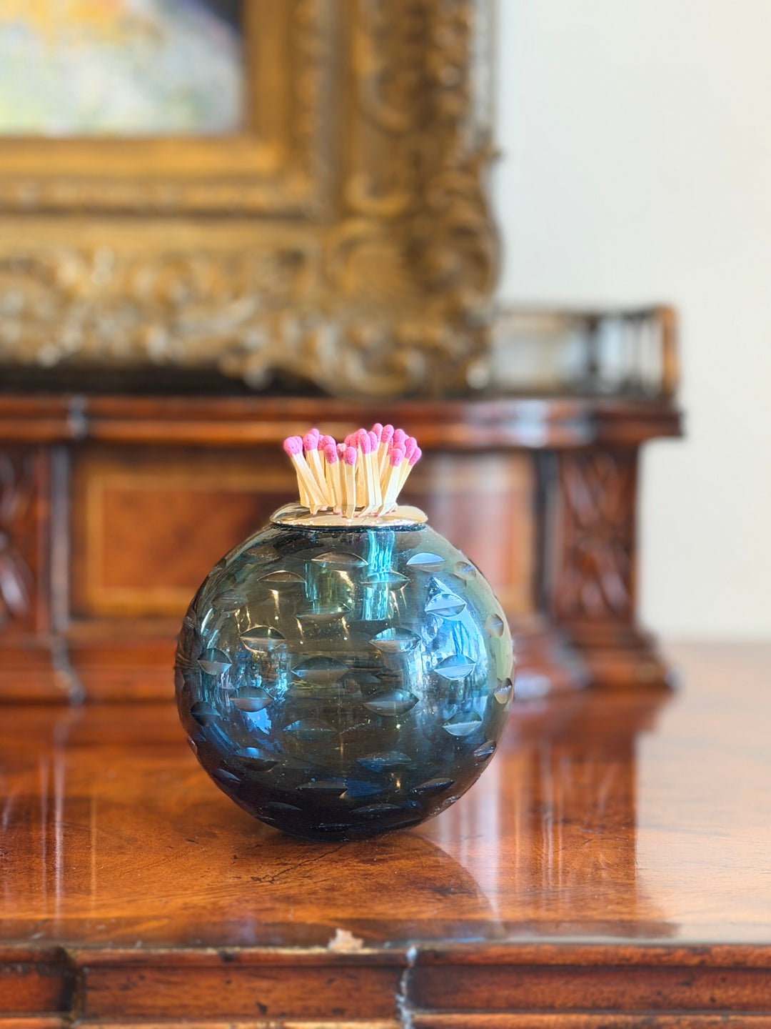 Teal glass match striker with silver collar, designed for safe and stylish match storage by Housebound Interiors.