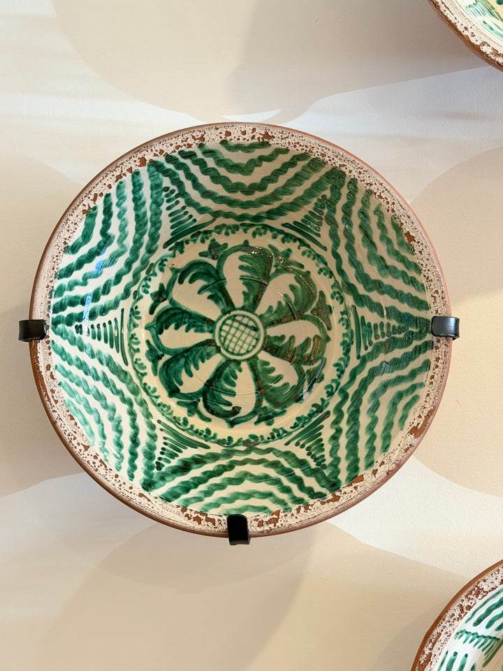 Large Andalusian green glazed ceramic basin with hand-painted sun design by Housebound Interiors.