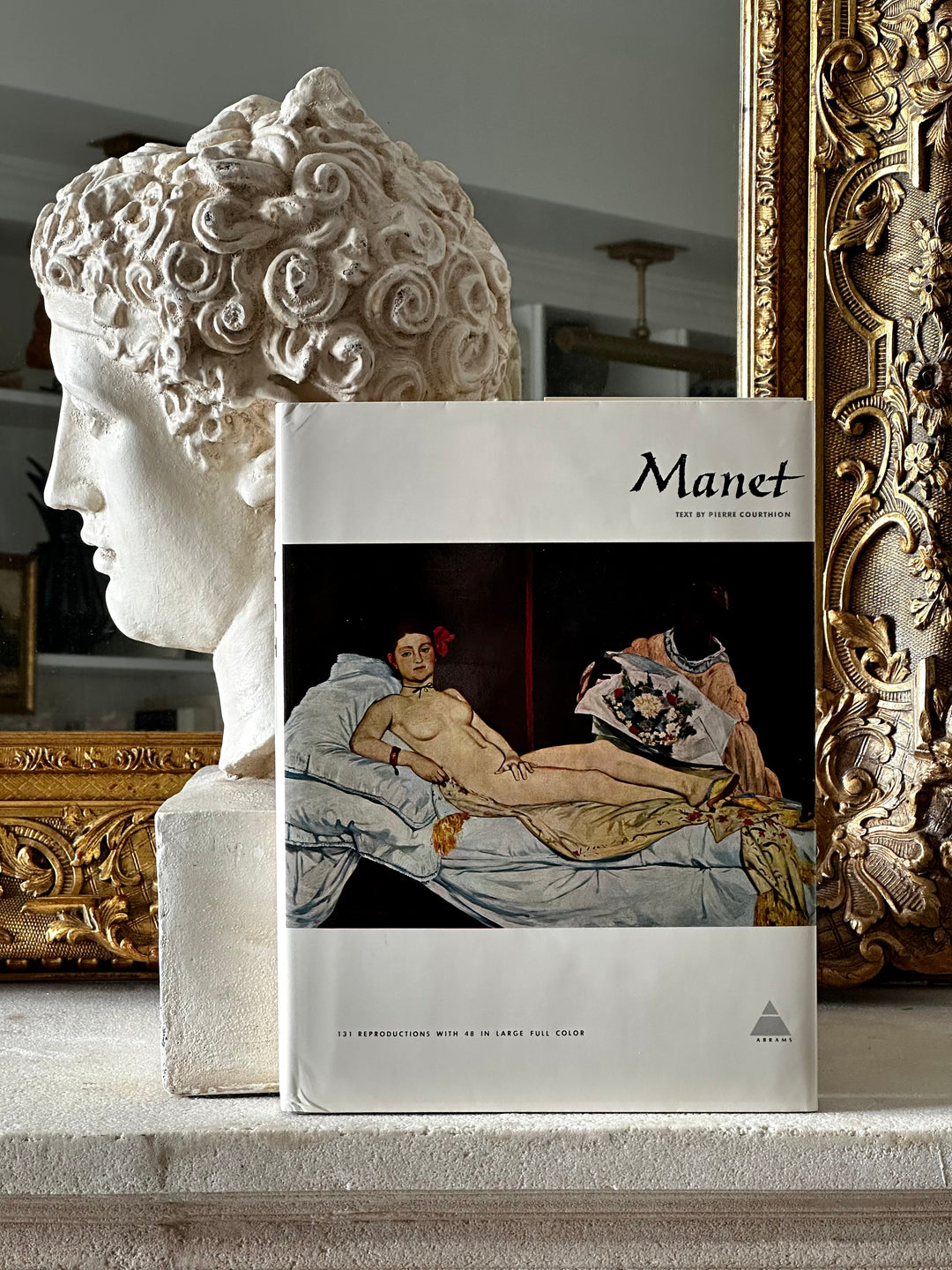 Open book featuring artwork by Édouard Manet from the Library of Great Painters collection by Housebound Interiors.