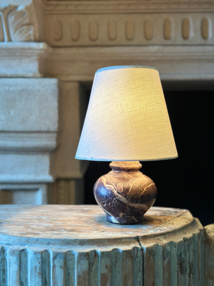 Petite dark brown marble table lamp with a sleek design, perfect for modern living spaces.
